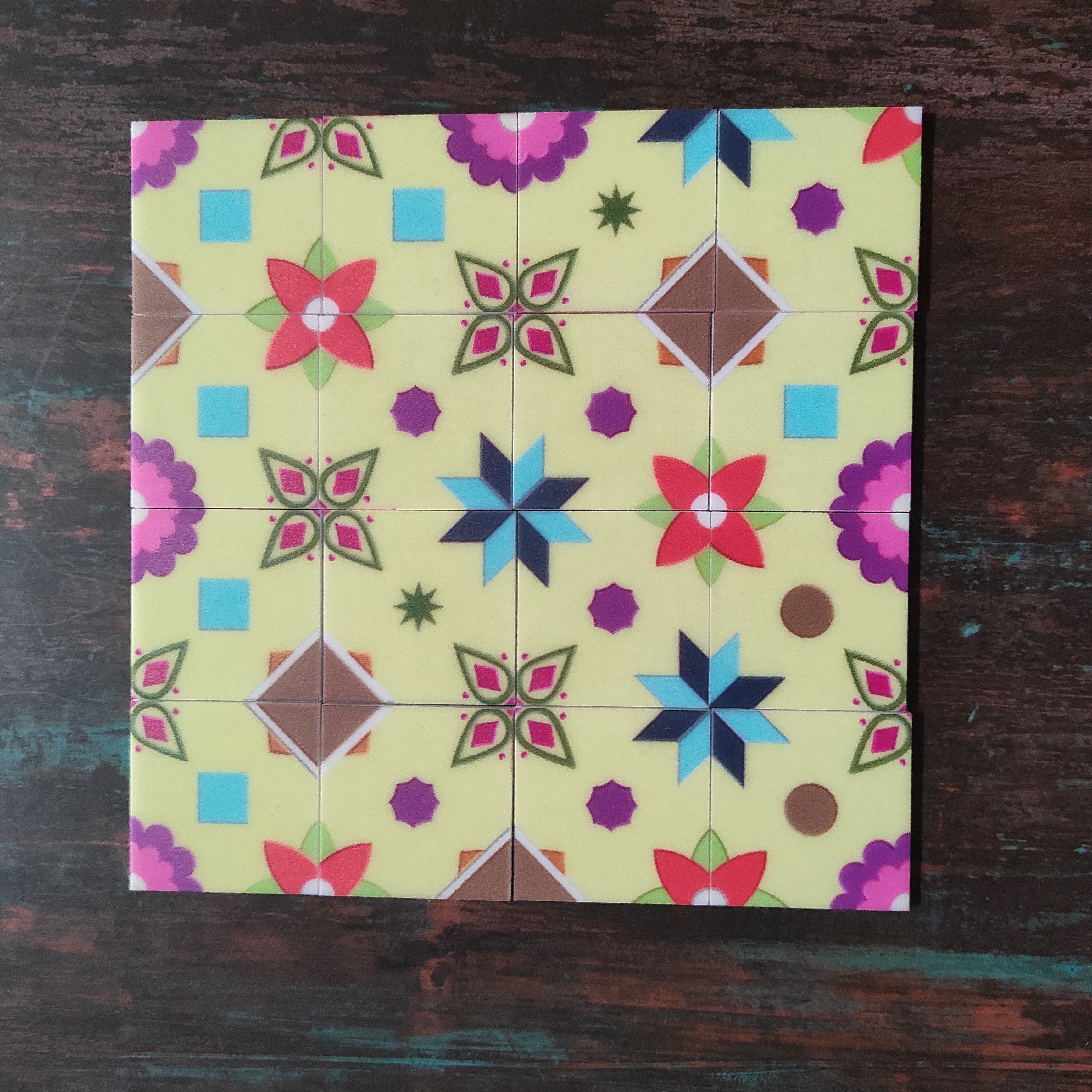 Tiles of the game Athangudi: Artisasn of Chettinad laid out in a 4x4 matrix to form a pleasing pattern. 